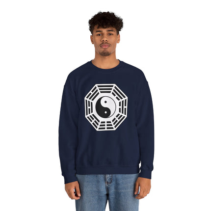 Geometric Yin Yang symbol graphic on a navy unisex pullover sweatshirt, representing Eastern philosophy.