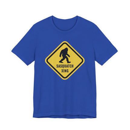 Blue t-shirt featuring a yellow Sasquatch Xing caution sign graphic and silhouette.