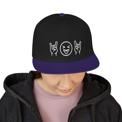 Black snapback hat with rock hand sign and emoji graphic on purple brim.