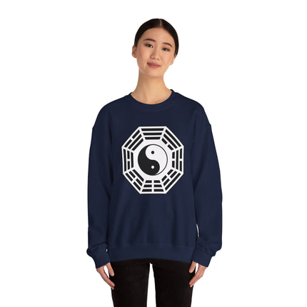 Geometric Taijitu Yin Yang symbol graphic on a navy blue pullover sweatshirt.