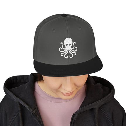 Gray snapback cap featuring a white embroidered octopus design.