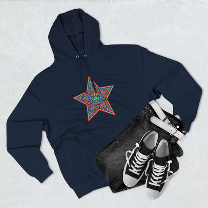 Vibrant Huichol star geometric art print on a dark blue pullover hoodie.