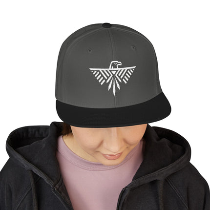 Thunderbird geometric embroidery on a black snapback hat.