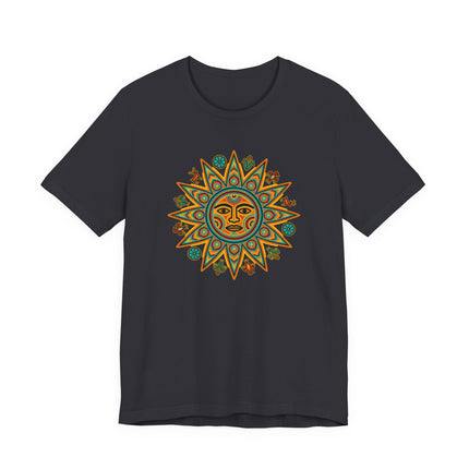 Dark t-shirt featuring a vibrant Huichol sun face graphic, inspired by Indigenous Mexican folk art and symbolism.
