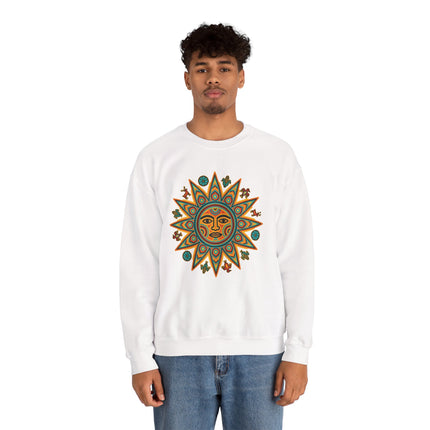 White sweatshirt featuring a vibrant Huichol sun symbol graphic, representing Mesoamerican indigenous art.