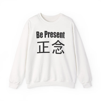 White pullover sweatshirt featuring "Be Present" and the 正念 kanji, a mindful Zen graphic design.