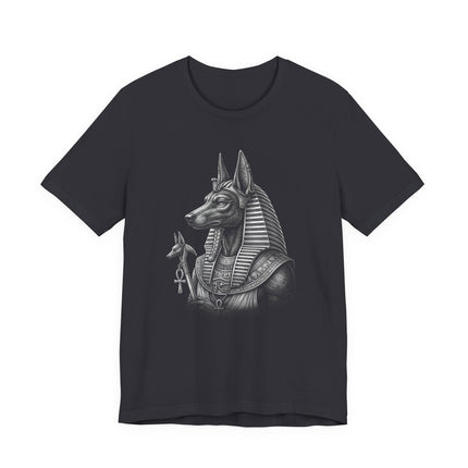 Monochrome Anubis jackal god design on a black t-shirt featuring Egyptian mythology.