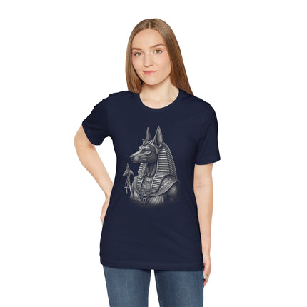 Monochrome Anubis Egyptian god illustration on a navy t-shirt.