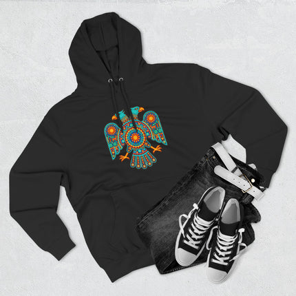 Vibrant Huichol two-headed eagle graphic on a black pullover hoodie featuring Mexican folk art.