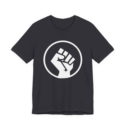Raised fist symbol graphic on a dark t-shirt, representing solidarity, power, and social justice.