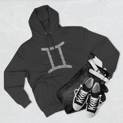 Black Gemini zodiac hoodie with ornate tribal pattern. Astrology apparel for cosmic fashion.