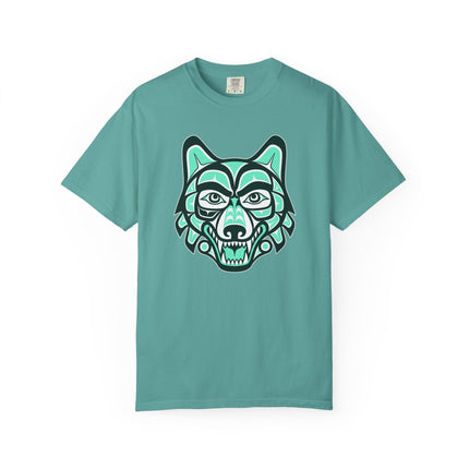 Indigenous Haida wolf head graphic in Formline art style on a teal t-shirt.