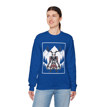 Cryptid antler skull graphic on blue sweatshirt, set against a mountain forest backdrop.