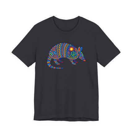 Colorful Huichol folk art armadillo graphic on a black t-shirt, featuring vibrant Mexican cultural patterns.