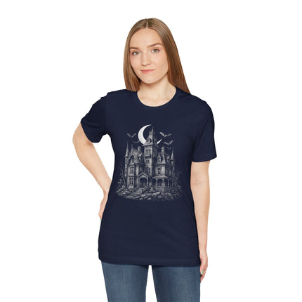 Haunted gothic mansion illustration with bats and crescent moon design on a dark tee.
