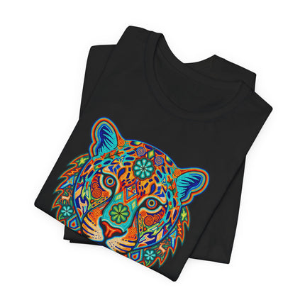 Vibrant tribal jaguar graphic tee featuring geometric Huichol-style spirit animal art on a black shirt.