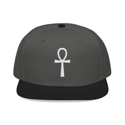 Embroidered Ankh symbol on a gray snapback hat.