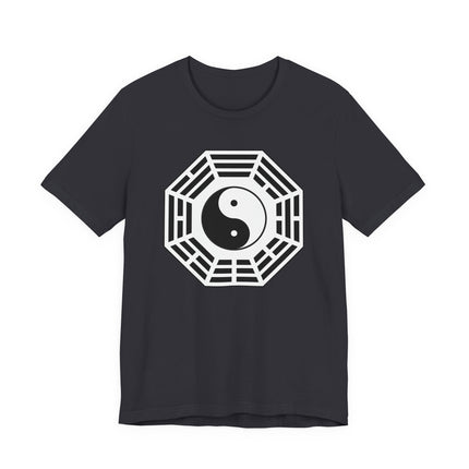 Yin Yang and Bagua symbol graphic on a dark t-shirt, representing balance and harmony.