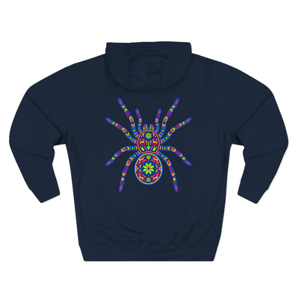 Colorful Huichol tarantula spider art print on a dark blue hoodie featuring Mexican folk design.