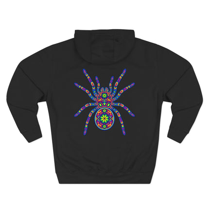 Vibrant Huichol tarantula spider art print on a black streetwear hoodie.