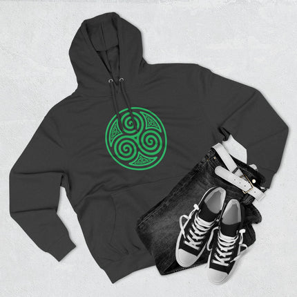 Celtic triskelion spiral symbol graphic on a black hoodie, featuring green celtic knot design.