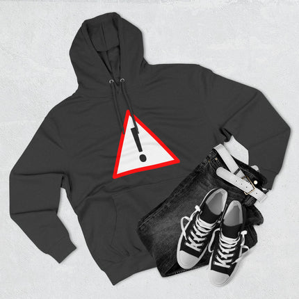 Black hoodie featuring a bold red caution triangle and exclamation mark graphic.