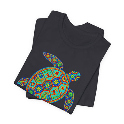 Colorful Huichol sea turtle graphic tee featuring vibrant Mexican folk art patterns.