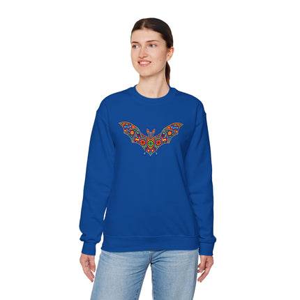 Blue sweatshirt featuring a vibrant Huichol-style bat graphic with colorful Mexican folk art designs.