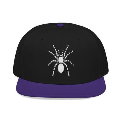 Black snapback cap featuring white embroidered tarantula spider design on a black crown and purple bill.