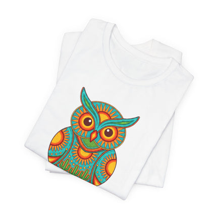 Stylized Huichol owl graphic tee with vibrant Mexican folk art and bohemian desert colors.