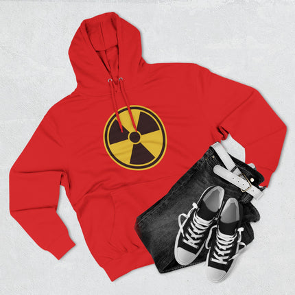 Red hoodie featuring a bold yellow and black radioactive hazard symbol graphic print.