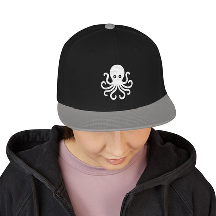 Black snapback cap featuring a white embroidered octopus design.