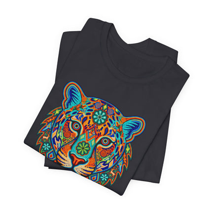 Vibrant Huichol-style jaguar tribal art graphic tee featuring colorful geometric spirit animal design.
