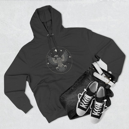 Norse raven knotwork graphic on a black pullover hoodie. Viking mythology design featuring spread wings.
