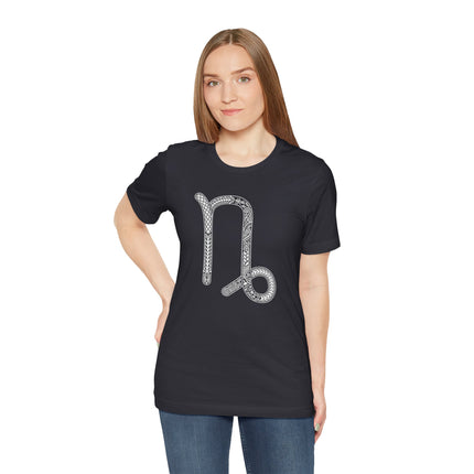 Capricorn zodiac symbol graphic tee with intricate white astrology design.