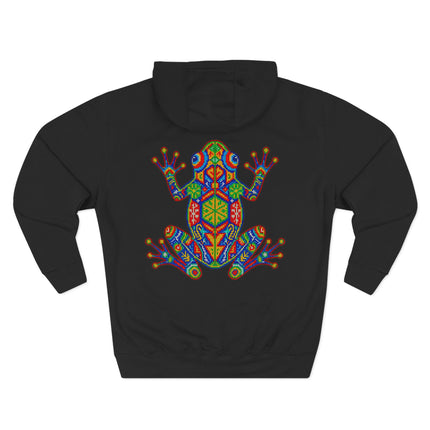 Colorful geometric frog design on a black hoodie, inspired by Huichol indigenous Mexican art.