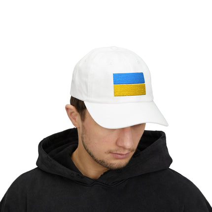 White embroidered baseball cap featuring the blue and yellow Ukrainian flag stripes.
