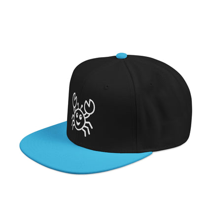 Black snapback cap with white embroidered cartoon crab and light blue bill.