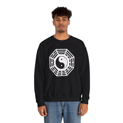 Stylized Yin Yang and Bagua symbol graphic on a black pullover sweatshirt.