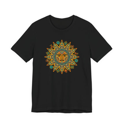 Huichol Sun Face graphic tee featuring vibrant indigenous Mexican folk art symbolism.