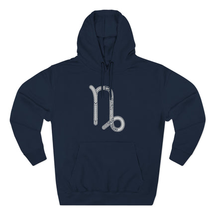 Ornate Capricorn zodiac symbol on a navy blue astrology hoodie.
