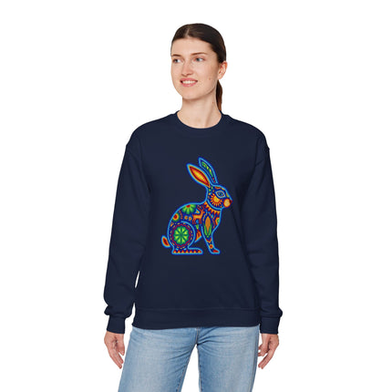 Vibrant Huichol art beaded rabbit graphic on a dark blue pullover sweatshirt.