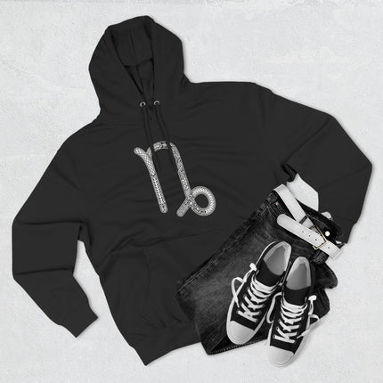 Ornate Capricorn zodiac symbol on a black unisex pullover hoodie.