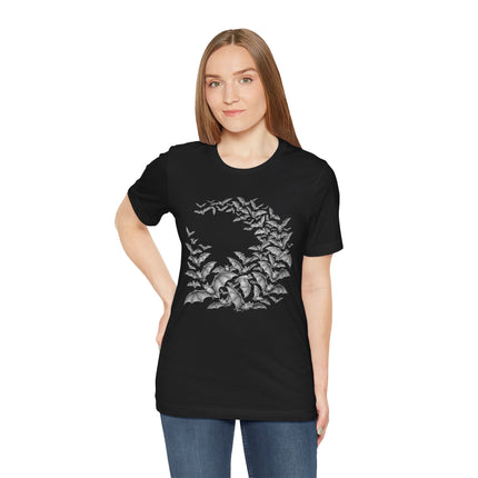 Gothic bat swarm graphic tee featuring bats flying through dark, detailed foliage.