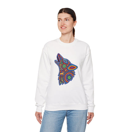 Colorful tribal wolf graphic in Huichol folk art style on a white sweatshirt.
