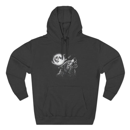 Mystical howling wolf under a full moon night sky graphic on a black hoodie.