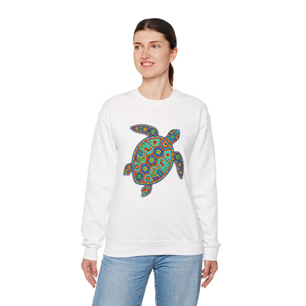 White sweatshirt featuring a vibrant Huichol-style geometric Mexican folk art turtle graphic print.