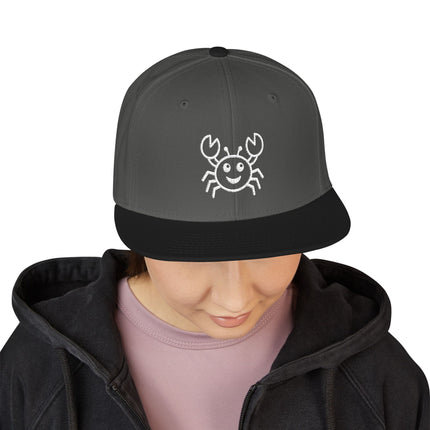 Embroidered smiling crab snapback cap, perfect for beach or casual wear.
