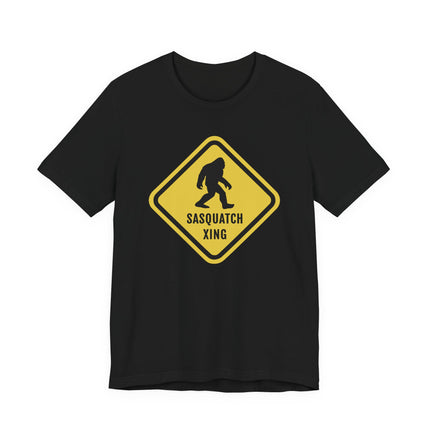 Sasquatch crossing sign graphic tee featuring a Bigfoot silhouette on a black shirt.