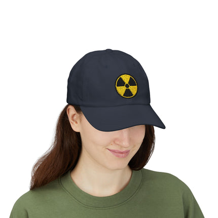 Black baseball cap featuring a yellow embroidered radioactive warning symbol.